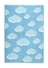 Blue, cloud patterned, machine washable rug for kids