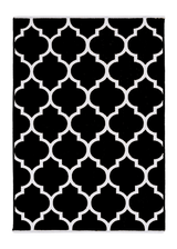 Black, white, geometric patterned, machine washable rug