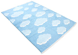 Blue, cloud patterned, machine washable rug for kids