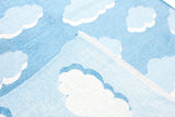 Blue, cloud patterned, machine washable rug for kids