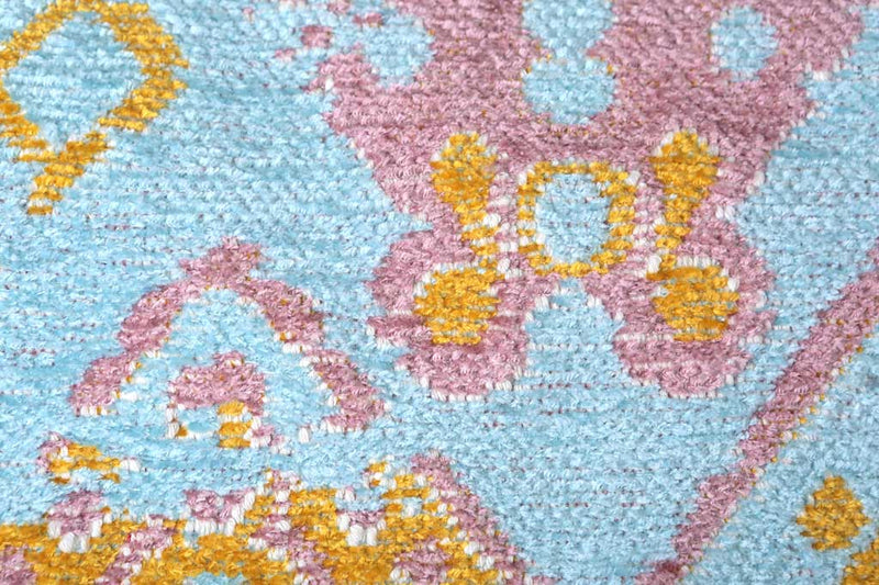 Turqoise, blue, yellow, pink, geometric patterned, machine washable rug