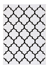 Black, white, geometric patterned, machine washable rug