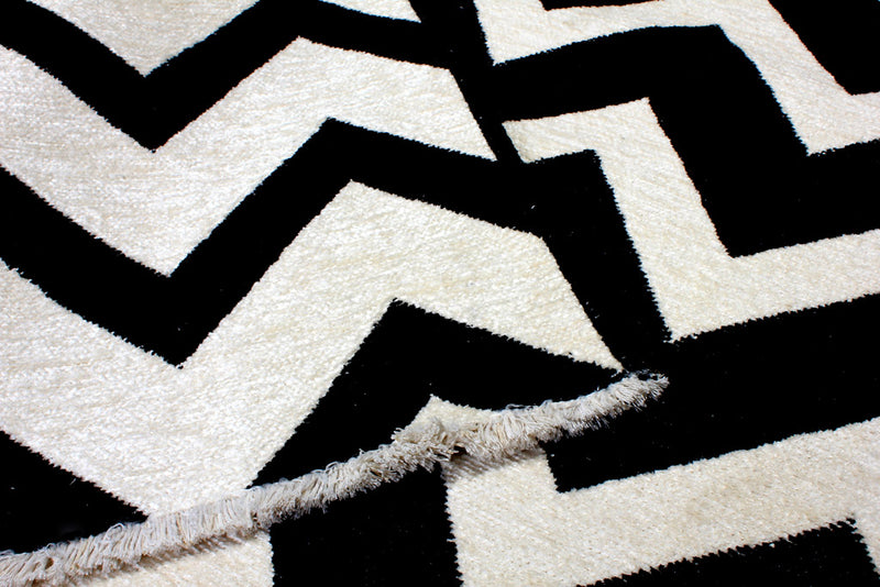 Black and white, geometric patterned, machine washable rug