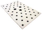 White, black, star patterned, machine washable rug for kids