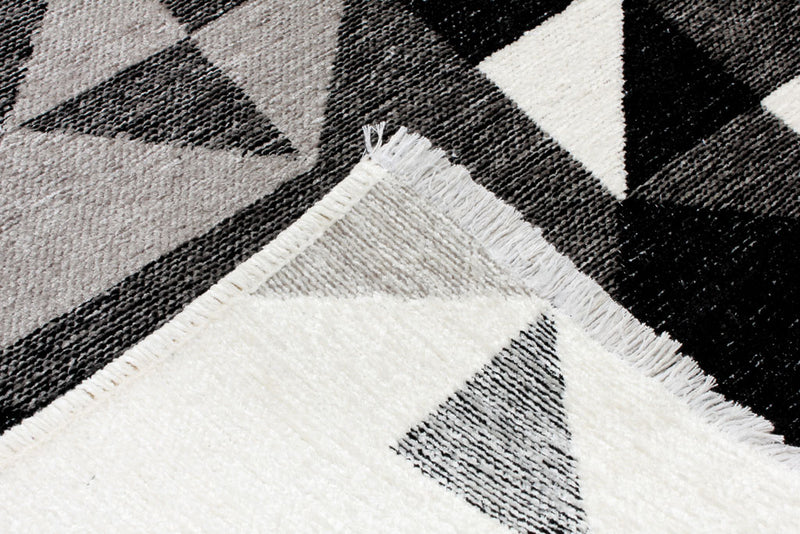 Black, gray, white, geometric patterned, machine washable rug